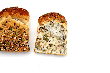 Sliced multigrain bread topped with pumpkin seeds, sunflower seeds, sesame, and black sesame.