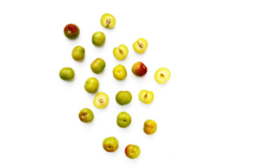 Fresh green plum fruit on white background.