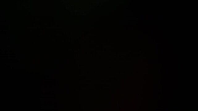 Lucent flare. Light defocused leak. Colorful beam glowing on dark background. Night ray nostalgic overlay abstract refraction effect.