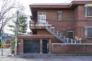 Typical residential house exterior in urban South Korea, showing everyday urban living environment.