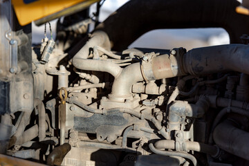 Close-up of construction workers filling plant and machinery with diesel fuel on building site