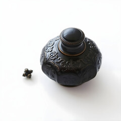 A delicate, antique ink pot with intricate engravings and a subtle sheen, placed centrally on a pristine white background