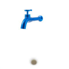 A solitary blue tap with a sleek metallic finish and prominent handle is centered on a pristine white background