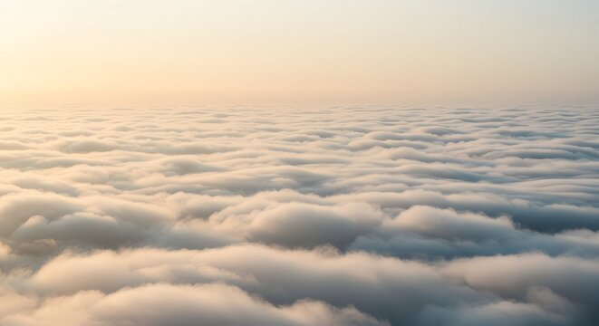 Aerial View of Fluffy Clouds at Sunrise or Sunset Above the Sky