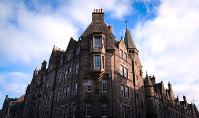Partial view of the landmark Gothic architecture built in 1869 in Edinburgh, Scotland, a historic civic structure with ornate stonework and vertical emphasis.