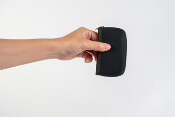 Black zippered bag in hand on white background