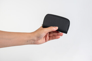 Black zippered bag in hand on white background