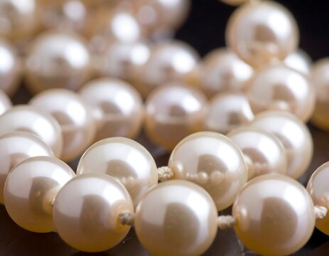 Close-up of a luminous, elegant strand of lustrous, creamy pearls