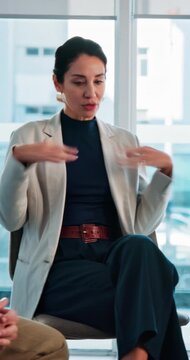 Business, woman and speaking in meeting for counseling, company wellness and mental health support. Empathy, mature person or team in office with conversation for EAP workshop, psychology or therapy.