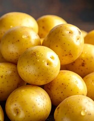 Close-up of a pile of small, golden, newly harvested potatoes