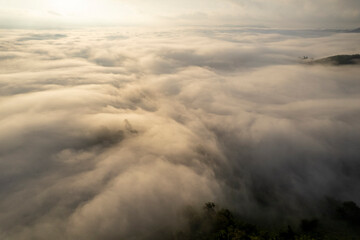 Landscape of Morning Mist with Mountain Layer. mountain ridge and clouds in rural jungle bush forest