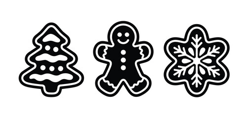 Three black and white christmas cookies shaped like a tree gingerbread man and snowflake