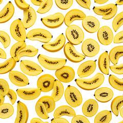 Sliced golden kiwi fruit with tiny seeds. Black backdrop texture