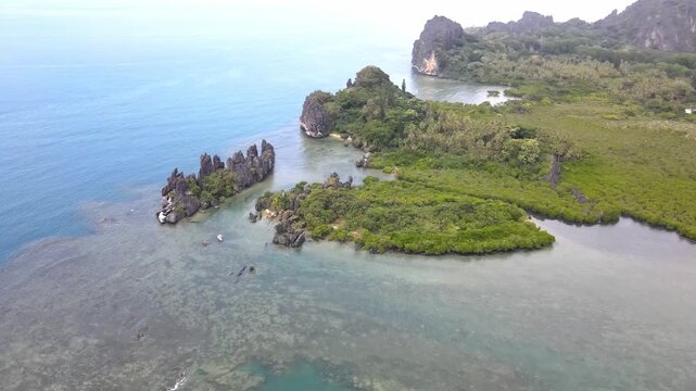 Drone aerial parallax at La Poule in New Caledonia with blue water and islands