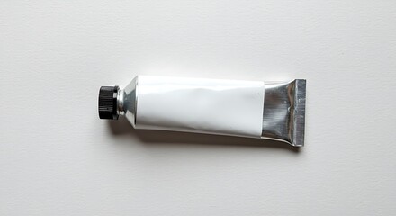 A blank aluminum tube with a black cap, isolated on a white background for commercial usage and mockups