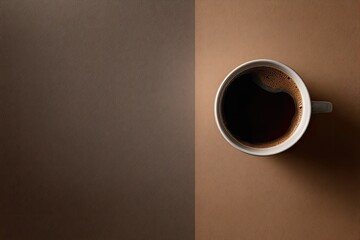 Overhead view of coffee in a mug, divided by two tones of brown, simple composition