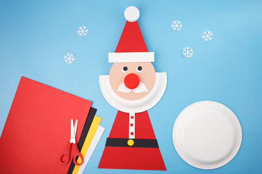Christmas craft project with handmade Santa Claus using paper plate and colored paper, ideal for holiday marketing, DIY blogs, kids activities, school events, and creative workshops