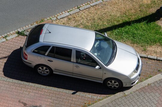 Silver Czech Skoda Fabia Combi estate car parked on street, top side view