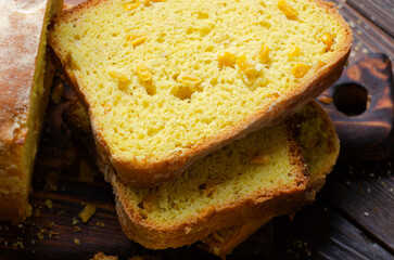 Homemade cornbread slices on kitchen table zoomed image