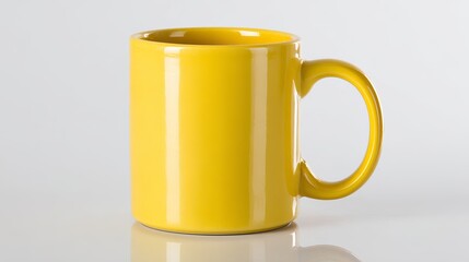 Bright yellow ceramic mug with handle, perfect for your morning coffee or tea, showcased on a clean white background.