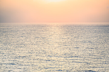 Obraz premium Beautiful orange sunrise sky over the sea horizon. Summer golden hour. 