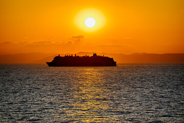 Beautiful orange sunrise sky over the sea horizon. Summer golden hour.