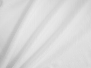 Close-up wavy cloth. White crumpled fabric background