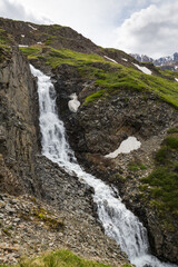 A view of the waterfall flowing down the steep cliff