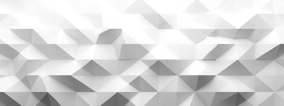 Abstract white geometric wall pattern with three-dimensional triangular shapes creating a modern architectural texture and light shadows