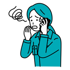 スマートフォンでの通話で困惑する作業員の女性