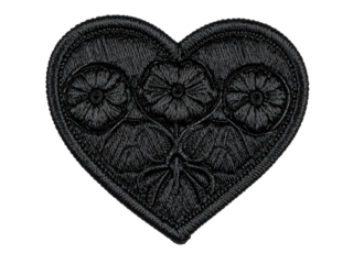 Black embroidered heart patch closeup isolated on white background, perfect for clothing, accessories, customization, or creative DIY projects and crafts.