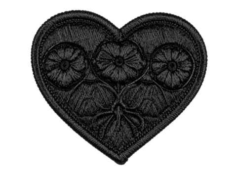 Black embroidered heart patch closeup isolated on white background, perfect for clothing, accessories, customization, or creative DIY projects and crafts.