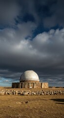 Fototapeta premium Ancient observatory under dramatic winter clouds on winter solstice for seasonal design