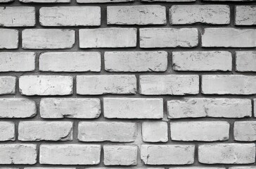 Obraz premium close-up of an old white brick wall with weathered texture and visible mortar in a horizontal pattern