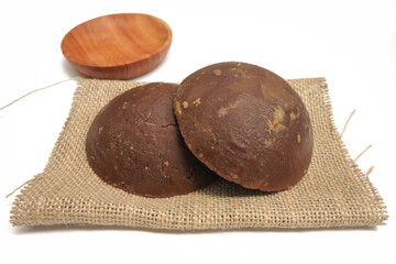 Palm Sugar on Burlap Fabric Isolated on White Background