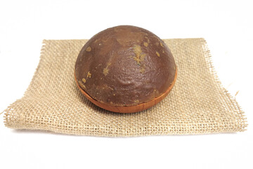 Palm Sugar on Burlap Fabric Isolated on White Background