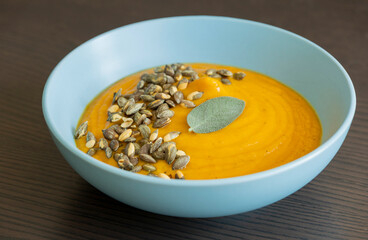 creamy butternut squash pumpkin soup with sage and pumpkin seeds cozy fall dinner