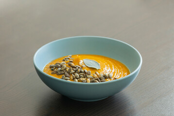 creamy butternut squash pumpkin soup with sage and pumpkin seeds cozy fall dinner
