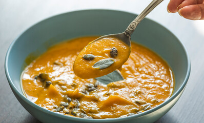 creamy butternut squash pumpkin soup with sage and pumpkin seeds cozy fall dinner