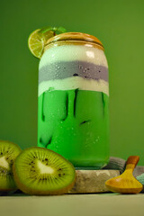 Healthy smoothie concept with natural fruit layers, kiwi slices, and bright minimalist green backdrop.