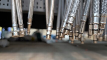 A Detailed CloseUp of Silver Metal Hoses Complete with Their Connectors and Fittings