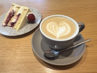 Cup of cappuccino on the table in a cafe, close up