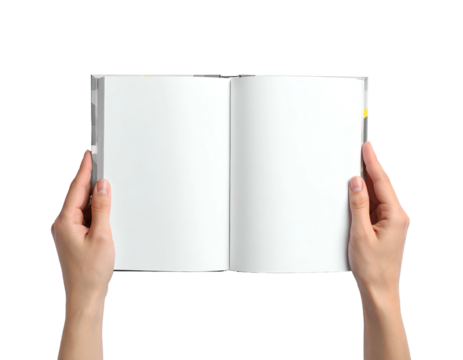 A person's hands hold open a blank book with bright white pages against a black backdrop