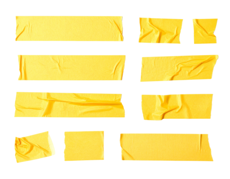 Assortment of yellow adhesive tape pieces, various sizes, placed against a black backdrop