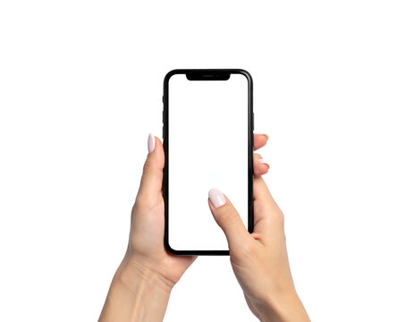 Two hands holding a black smartphone with blank, white screen against a black background - Powered by Adobe