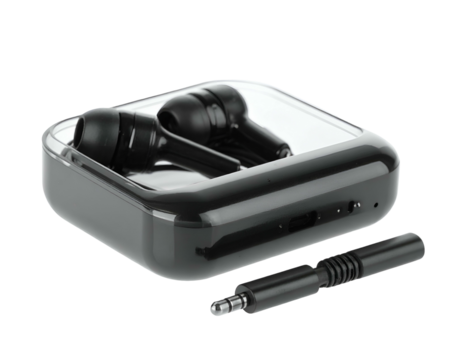 Black wireless earbuds with charging case and a separate audio cable in a darkened setting