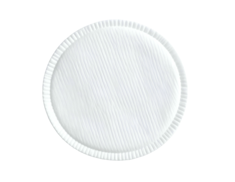 Single white circular pad, textured center, ribbed edges, seen isolated against a black backdrop
