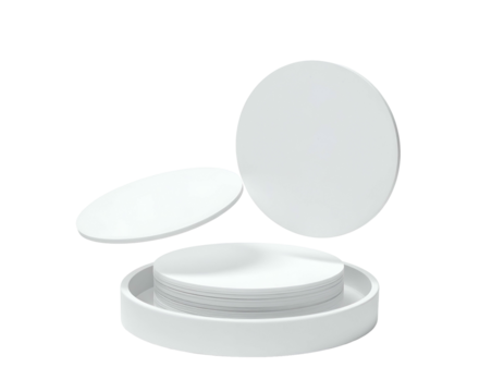 Isolated white round discs, stacked on a tray, with one disc levitating above the stack