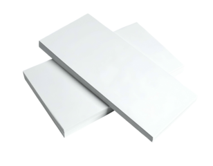 Close-up of three white, rectangular objects stacked on a black background, with visible shadows