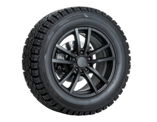 Black car tire and alloy wheel, winter tread pattern, isolated on a dark background